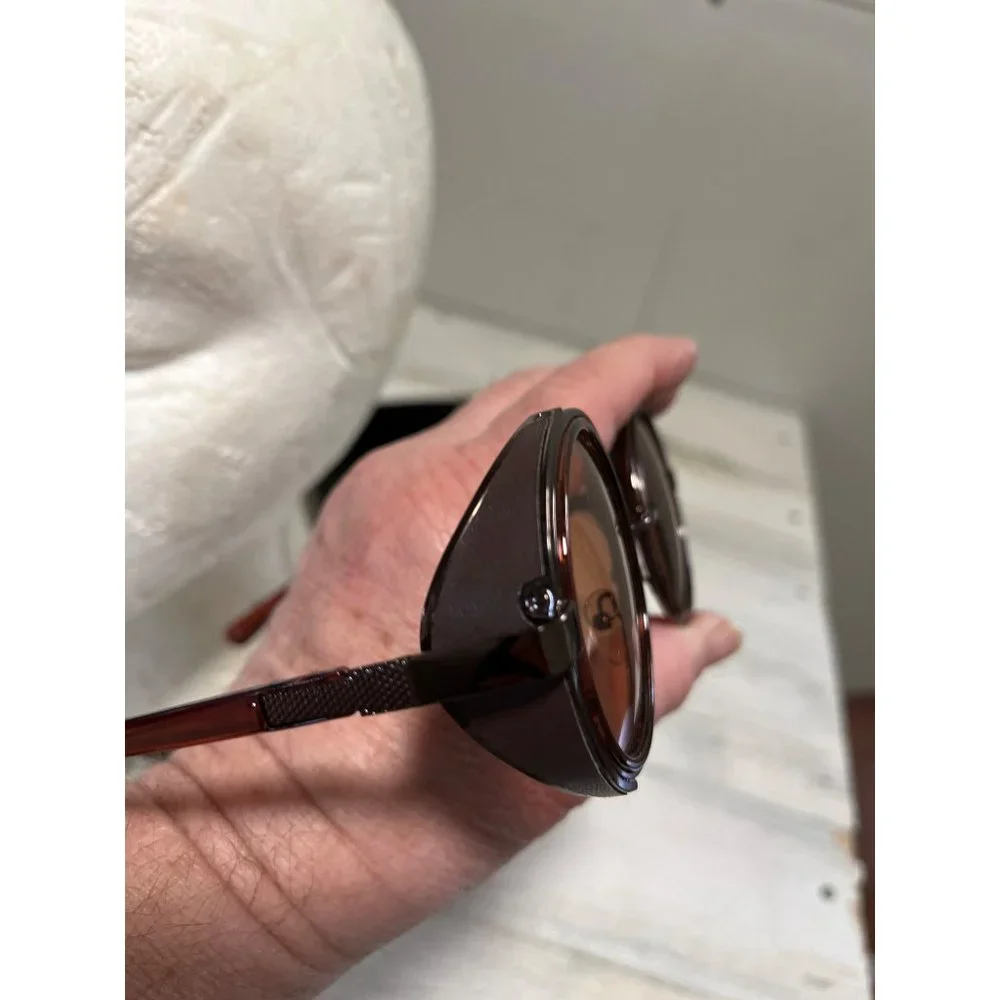 Glasses round amber tinted with black case
